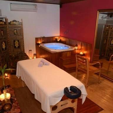 Premium spa bed in a warm tropical wellness interior